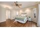 Spacious main bedroom features wood floors, backyard views, and a ceiling fan at 8120 Greenbrier Ct, Spring Hill, FL 34606