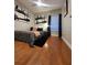 Stylish bedroom featuring hardwood floors, contemporary art, and a comfortable, inviting bed at 824 Greenbelt Cir, Brandon, FL 33510