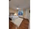 Cozy bedroom with hardwood floors, a plush rug, and a serene window view for a relaxing atmosphere at 824 Greenbelt Cir, Brandon, FL 33510