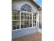 Exterior of home with large windows offering an inside glimpse of interior design and style at 824 Greenbelt Cir, Brandon, FL 33510