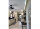 Bright kitchen featuring tiled floors, granite counters, and stainless steel appliances at 824 Greenbelt Cir, Brandon, FL 33510