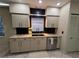 Modern kitchen sink area with granite countertops, stylish cabinets, and a black tile backsplash at 824 Greenbelt Cir, Brandon, FL 33510