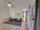 Bright living room with vaulted ceiling, large windows, and tile floors at 824 Greenbelt Cir, Brandon, FL 33510