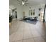 Bright living room with tile flooring, ceiling fan, and a wall of windows at 824 Greenbelt Cir, Brandon, FL 33510