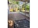 Spacious screened porch with tile flooring, offering views of the private, landscaped backyard at 824 Greenbelt Cir, Brandon, FL 33510