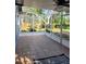 Large screened-in lanai with tile flooring overlooking a well-maintained, private backyard at 824 Greenbelt Cir, Brandon, FL 33510