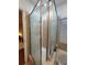 Elegant glass shower with rainfall showerhead and modern fixtures in the Primary bathroom at 824 Greenbelt Cir, Brandon, FL 33510