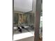 Chic wine rack featuring a mirrored tiled backsplash and transparent bottle holders at 824 Greenbelt Cir, Brandon, FL 33510