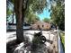 Exterior view with a motorcycle, boat, and outdoor seating on a brick-paved area, perfect for outdoor living at 8516 N Dixon Ave, Tampa, FL 33604