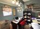 Functional office space with a large desk, shelves, and comfortable seating area at 8516 N Dixon Ave, Tampa, FL 33604
