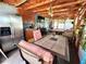 Inviting outdoor dining area with kitchenette and a pool table for entertaining guests at 8516 N Dixon Ave, Tampa, FL 33604