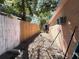 Narrow side yard with mixed fencing and exterior air conditioning unit at 8516 N Dixon Ave, Tampa, FL 33604