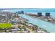 An aerial view showcases neighborhood along the waterway with boat docks and a clear blue sky at 8801 Gulf Blvd, St Petersburg, FL 33706