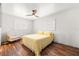 Bright bedroom featuring wood floors, a ceiling fan, and natural light at 8801 Gulf Blvd, St Petersburg, FL 33706