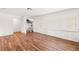 Well-lit room with wood-look flooring, large windows with shutters, and a neutral color palette at 8801 Gulf Blvd, St Petersburg, FL 33706