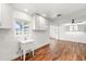 This utility area features bright light, wood-look flooring, views of the pool area, and ample storage at 8801 Gulf Blvd, St Petersburg, FL 33706