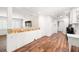 Convenient laundry area with adjacent spaces, wood-look flooring, and neutral tones at 8801 Gulf Blvd, St Petersburg, FL 33706