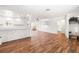 Bright and airy living space features wood-look flooring, white walls and trim, and an open floor plan at 8801 Gulf Blvd, St Petersburg, FL 33706