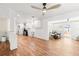 Open-concept space featuring wood-look floors, modern lighting, and access to an outdoor seating area at 8801 Gulf Blvd, St Petersburg, FL 33706