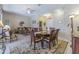Open-concept living and dining area featuring tile floors, plenty of light, and comfortable furnishings at 965 Westwinds Blvd, Tarpon Springs, FL 34689