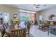 Spacious living room with views of the screened-in lanai and pool area, ideal for indoor-outdoor living at 965 Westwinds Blvd, Tarpon Springs, FL 34689