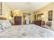 Bright main bedroom with a large bed, ample closet space, and en-suite bathroom at 965 Westwinds Blvd, Tarpon Springs, FL 34689