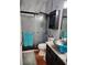 Stylish bathroom featuring marble counters and a glass door shower at 10327 Meadow Crossing Dr, Tampa, FL 33647