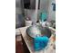 Unique bathroom vanity with an artistic bowl sink and modern finishes at 10327 Meadow Crossing Dr, Tampa, FL 33647