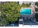 Aerial view of a community pool surrounded by lush trees and community buildings at 105 4Th Ne Ave # 219, St Petersburg, FL 33701