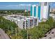 Aerial view of the property surrounded by mature trees and landscaping in the city at 105 4Th Ne Ave # 219, St Petersburg, FL 33701