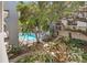 Aerial shot showcases community pool surrounded by tropical landscaping and walkways at 105 4Th Ne Ave # 219, St Petersburg, FL 33701