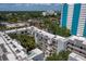Overhead shot of condo complex showing surrounding city buildings, trees and a blue sky with scattered clouds at 105 4Th Ne Ave # 219, St Petersburg, FL 33701