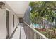 Balcony with a view of lush greenery and a sparkling pool area at 105 4Th Ne Ave # 219, St Petersburg, FL 33701