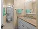 Bright bathroom featuring updated vanity, glass bowl sink, and modern tiling at 105 4Th Ne Ave # 219, St Petersburg, FL 33701