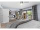Bright, airy bedroom with mirrored wall, comfortable seating, and large balcony access at 105 4Th Ne Ave # 219, St Petersburg, FL 33701