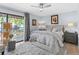 Light-filled bedroom features calming colors, a walkout balcony and stylish furnishings at 105 4Th Ne Ave # 219, St Petersburg, FL 33701