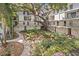 Apartment courtyard with mature trees, lush landscaping and charming walkways at 105 4Th Ne Ave # 219, St Petersburg, FL 33701