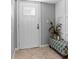 Entryway featuring tiled floors, a gray wall, and white door at 105 4Th Ne Ave # 219, St Petersburg, FL 33701