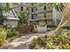 Community grilling area featuring a built-in grill, patio, and lush landscaping at 105 4Th Ne Ave # 219, St Petersburg, FL 33701