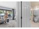 Inviting hallway showcasing bedroom with walkout, and bathroom with updated fixtures at 105 4Th Ne Ave # 219, St Petersburg, FL 33701