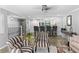 Sunlit living space features a kitchen bar, fashionable armchairs, and modern finishes at 105 4Th Ne Ave # 219, St Petersburg, FL 33701