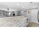 Bright, open living space with kitchen island and access to the exterior at 105 4Th Ne Ave # 219, St Petersburg, FL 33701