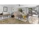 Cozy living room with neutral tones, striped chairs, and access to a private balcony at 105 4Th Ne Ave # 219, St Petersburg, FL 33701