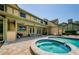 Beautiful backyard with a sparkling pool, spa, and covered patio for outdoor living at 10600 Indian Hills Ct, Seminole, FL 33777