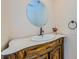 Bathroom featuring a decorative mirror, vanity, and sink at 10600 Indian Hills Ct, Seminole, FL 33777