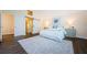 Charming bedroom featuring a barn door to ensuite, luxury rug and stylish decor at 10600 Indian Hills Ct, Seminole, FL 33777