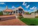 Stunning clubhouse with brick facade, manicured lawn, and inviting entrance at 10600 Indian Hills Ct, Seminole, FL 33777