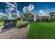Well-maintained grounds leading to the Bardmoor Golf & Tennis Club clubhouse at 10600 Indian Hills Ct, Seminole, FL 33777