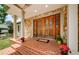 Inviting front entrance featuring a grand double door, brick steps, and stone accents at 10600 Indian Hills Ct, Seminole, FL 33777