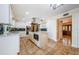Bright kitchen features an island, stainless steel appliances, and stone tile flooring at 10600 Indian Hills Ct, Seminole, FL 33777